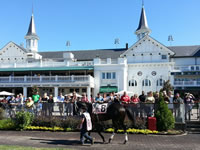 WEB-SK-in-front-of-Churchill-Downs-Twin-Spires